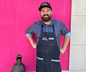 Marcos Campos in front of pink wall
