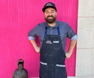 Marcos Campos in front of pink wall