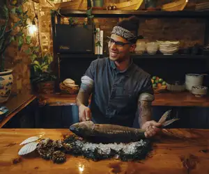 Chef descaling fish