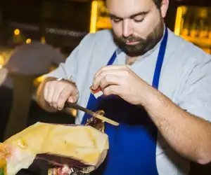 Chef cutting Jamon Iberico