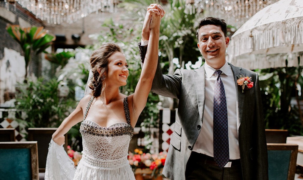 Bride and Groom holding hands