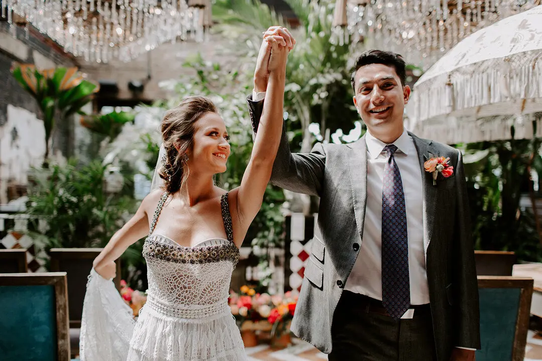 Bride and Groom holding hands