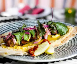 Dish garnished with greens