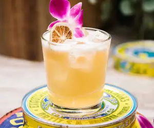 Cocktail garnished with orchid