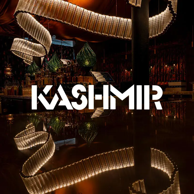 Kashmir restaurant interior with an overlaying logo