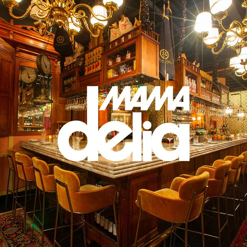 Mama Delia restaurant interior with an overlaying logo